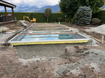 Fiberglass pool installation in progress during the Build phase of a Rockwest Creative outdoor project.